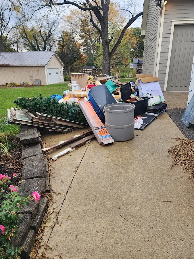 Dumpster being loaded with debris for 3 Yard Dumpster Rental in Oakwood